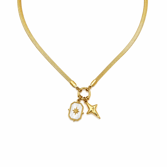 A close-view of a gold-plated stainless steel chain for women featuring a flat snake chain and two celestial star charms, one with a pearl inlay
