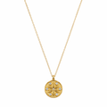 A gold-plated stainless steel chain for women featuring a circular medallion pendant with an embossed star pattern and seven sparkling crystals.