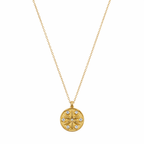 A gold-plated stainless steel chain for women featuring a circular medallion pendant with an embossed star pattern and seven sparkling crystals.