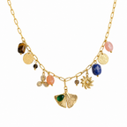 A close-view of a gold-plated stainless steel chain for women featuring paperclip links and a variety of charms including a ginkgo leaf, lapis lazuli, and rose quartz beads