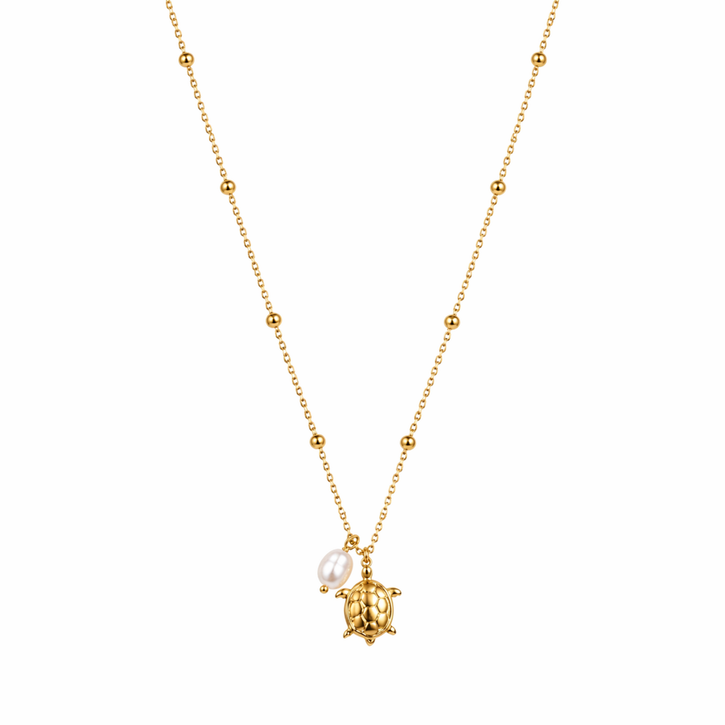 A gold-plated stainless steel chain for women featuring small bead stations and a sea turtle pendant with a single pearl
