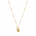 A gold-plated stainless steel chain for women featuring small bead stations and a sea turtle pendant with a single pearl