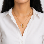 A gold-plated stainless steel chain for women featuring small bead stations and a sea turtle pendant with a single pearl shown on a model