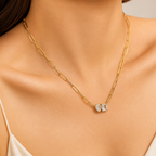 Gold chain necklace with a diamond pendant on a model