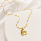 A gold-plated stainless steel chain for women featuring a polished 3D puffed heart pendant set at a tilt on a delicate link chain.