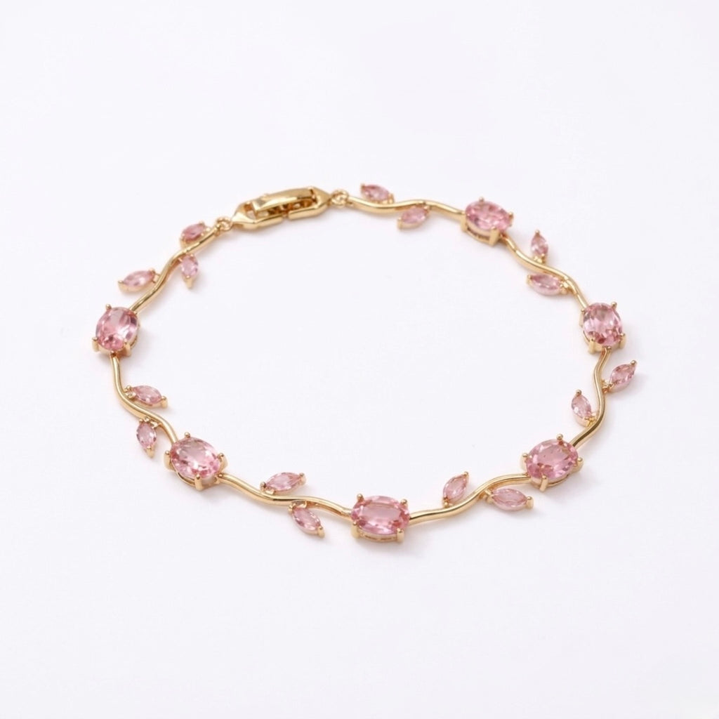 A gold-plated tulip vine chain bracelet for women featuring soft pink oval and marquise-cut stones, shown on a clean white background