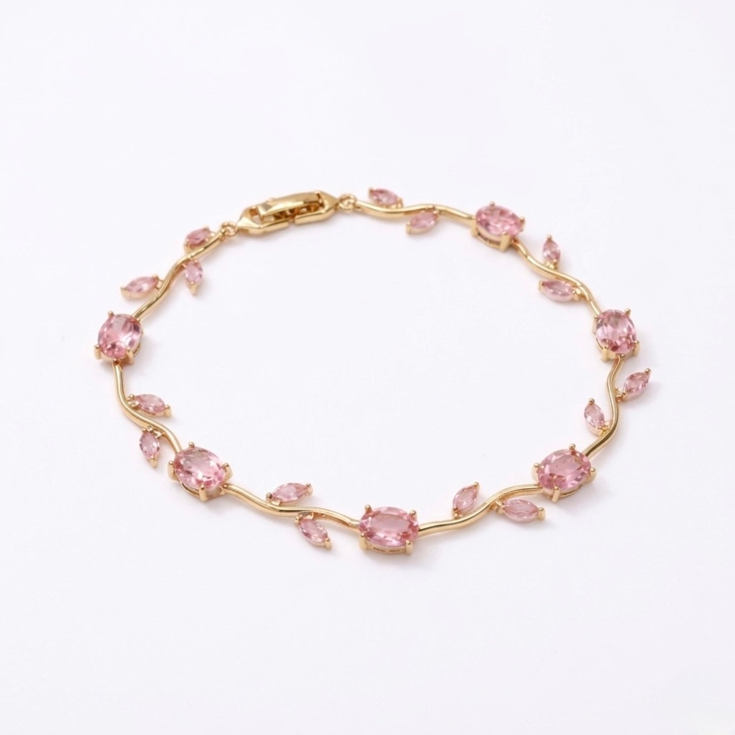 A gold-plated tulip vine chain bracelet for women featuring soft pink oval and marquise-cut stones, shown on a clean white background