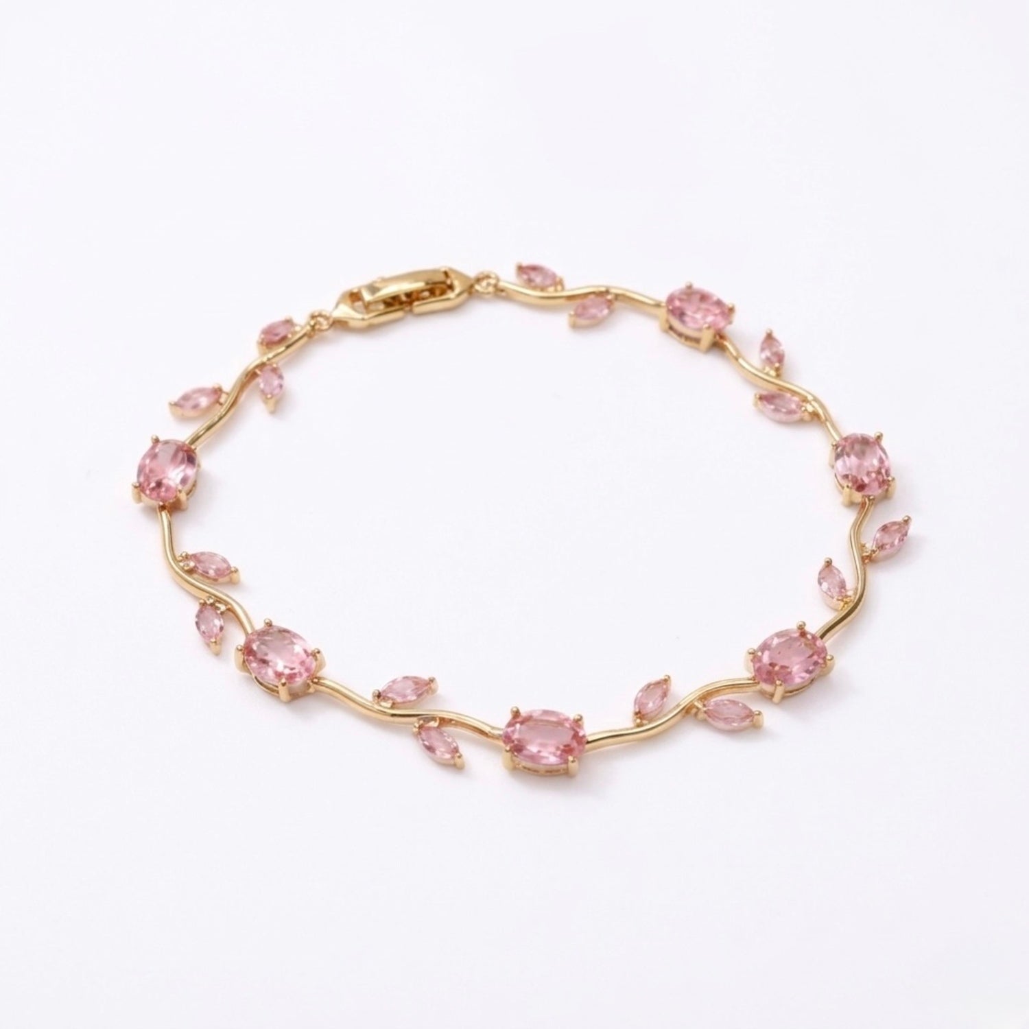 A gold-plated tulip vine chain bracelet for women featuring soft pink oval and marquise-cut stones, shown on a clean white background