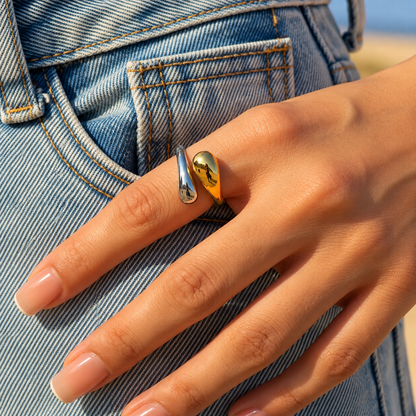 Two-Tone Sculptural Adjustable Ring with polished gold and silver curved elements in an open design.