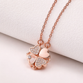A rose gold-plated stainless steel chain for women featuring a magnetic clover pendant that unfolds into four crystal-embellished hearts.