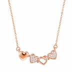 A rose gold-plated stainless steel chain for women featuring a magnetic clover pendant that unfolds into four crystal-embellished hearts.