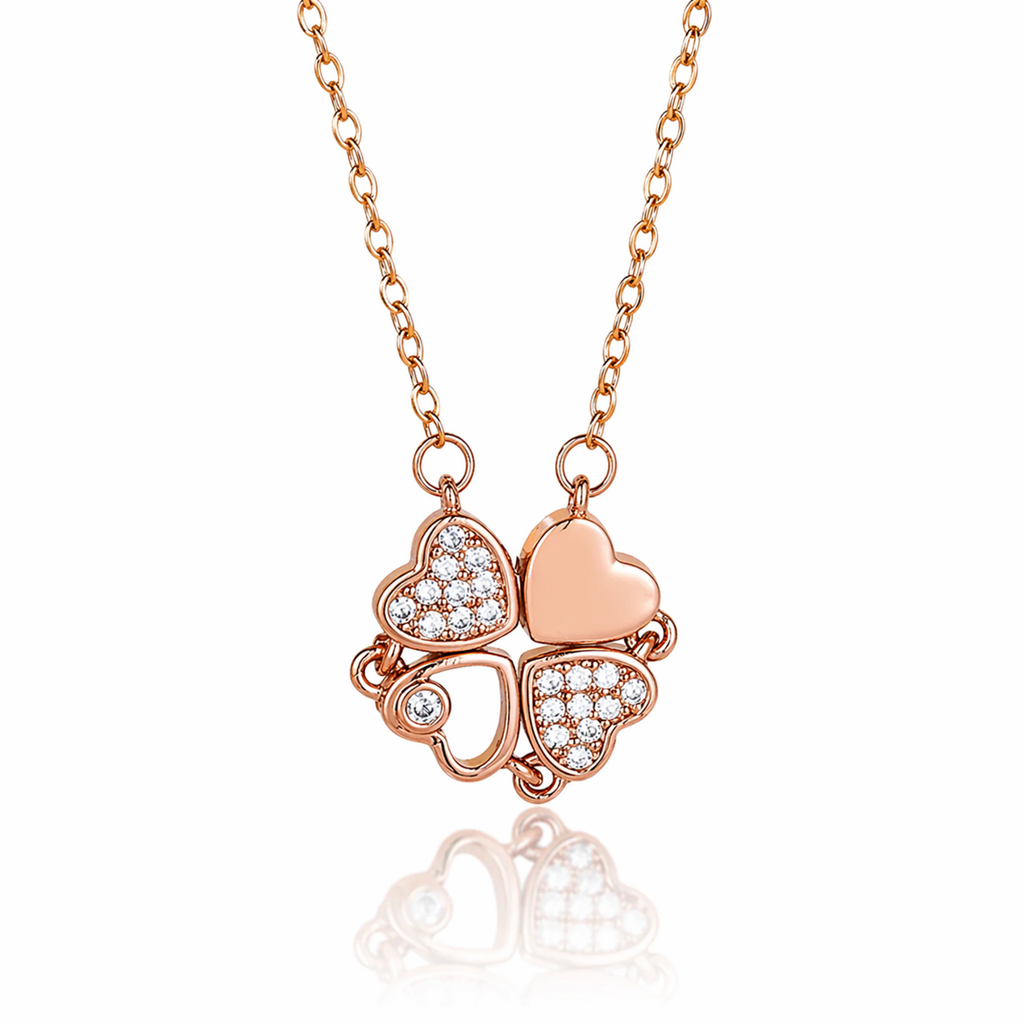 A close-view of rose gold-plated stainless steel chain for women featuring a magnetic clover pendant that unfolds into four crystal-embellished hearts.