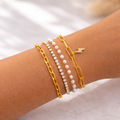 A versatile 2-in-1 gold-plated jewelry piece shown as both a layered bracelet for women