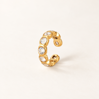 Gold-tone Crystal Ear Cuff with multiple clear faceted crystals in rounded settings.