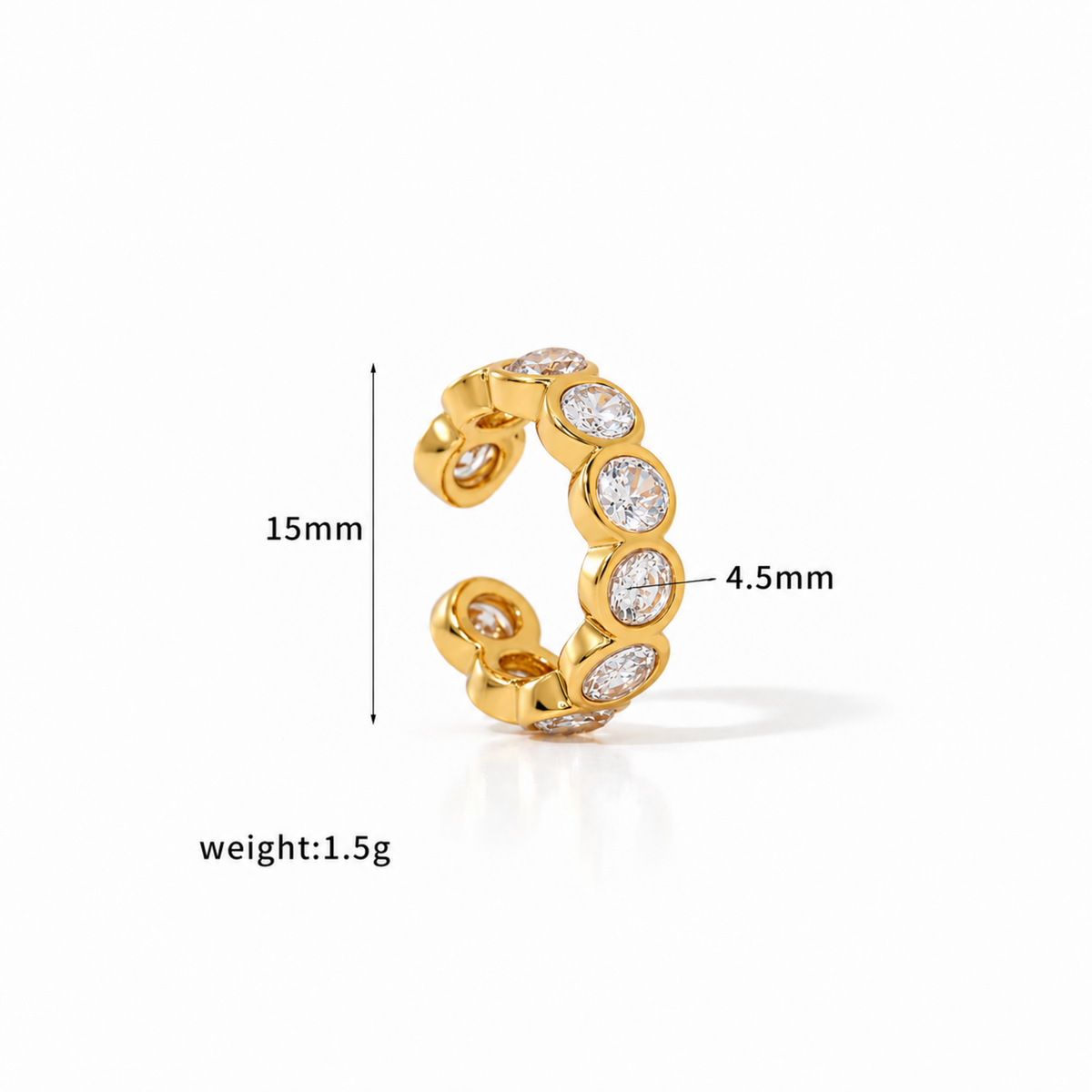 Gold-tone Crystal Ear Cuff with multiple clear faceted crystals in rounded settings.