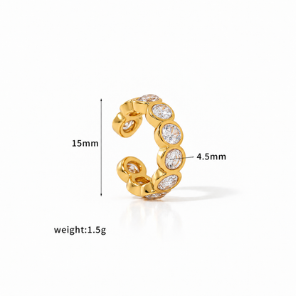 Gold-tone Crystal Ear Cuff with multiple clear faceted crystals in rounded settings.