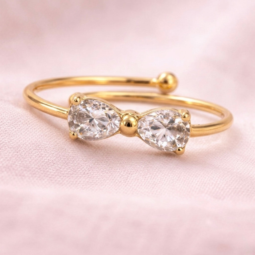 A close view of dainty gold plated adjustable ring for women featuring a bow design